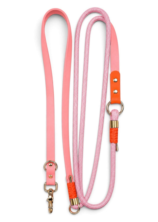 Laisse multi-positions pour chien en Biothane et paracorde rose et orange Malibu par la marque française PLI Paris.