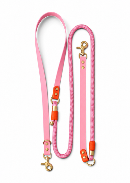 Laisse multi-positions pour chien en Biothane et paracorde rose et orange Malibu par la marque française PLI Paris.