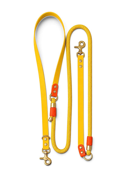 Laisse multi-positions pour chien en Biothane et paracorde jaune et orange Miami par la marque française PLI Paris.